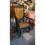 A Late Victorian Ebonised Framed Rocking Chair