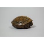 A Carved Wooden Netsuke in the form of a Tortoise, signed, 4.5cm wide x 2cm high