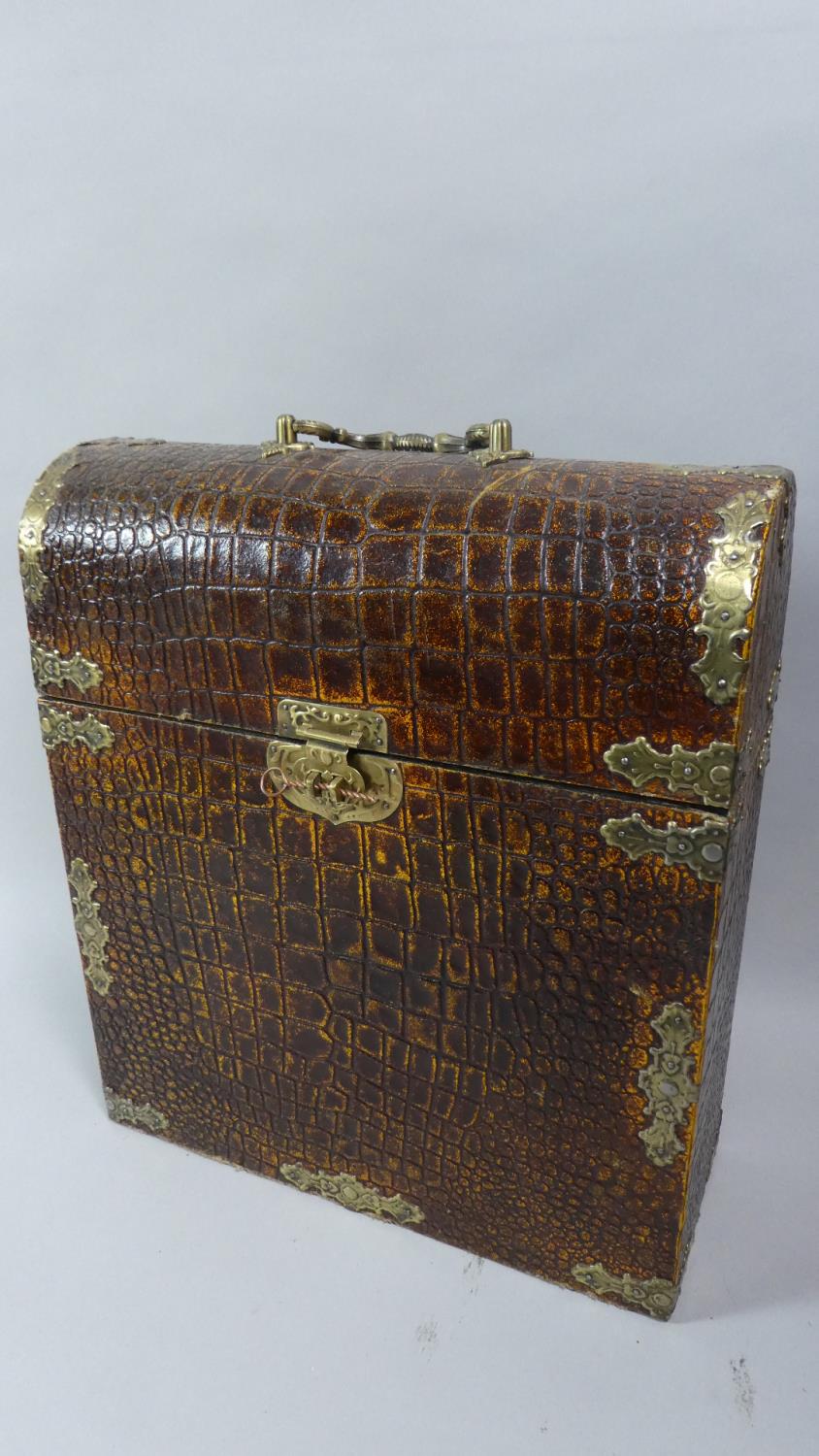 A Faux Crocodile Skin Dome Top Wooden Box with Brass Clasp and Carrying Handle, 36cm High