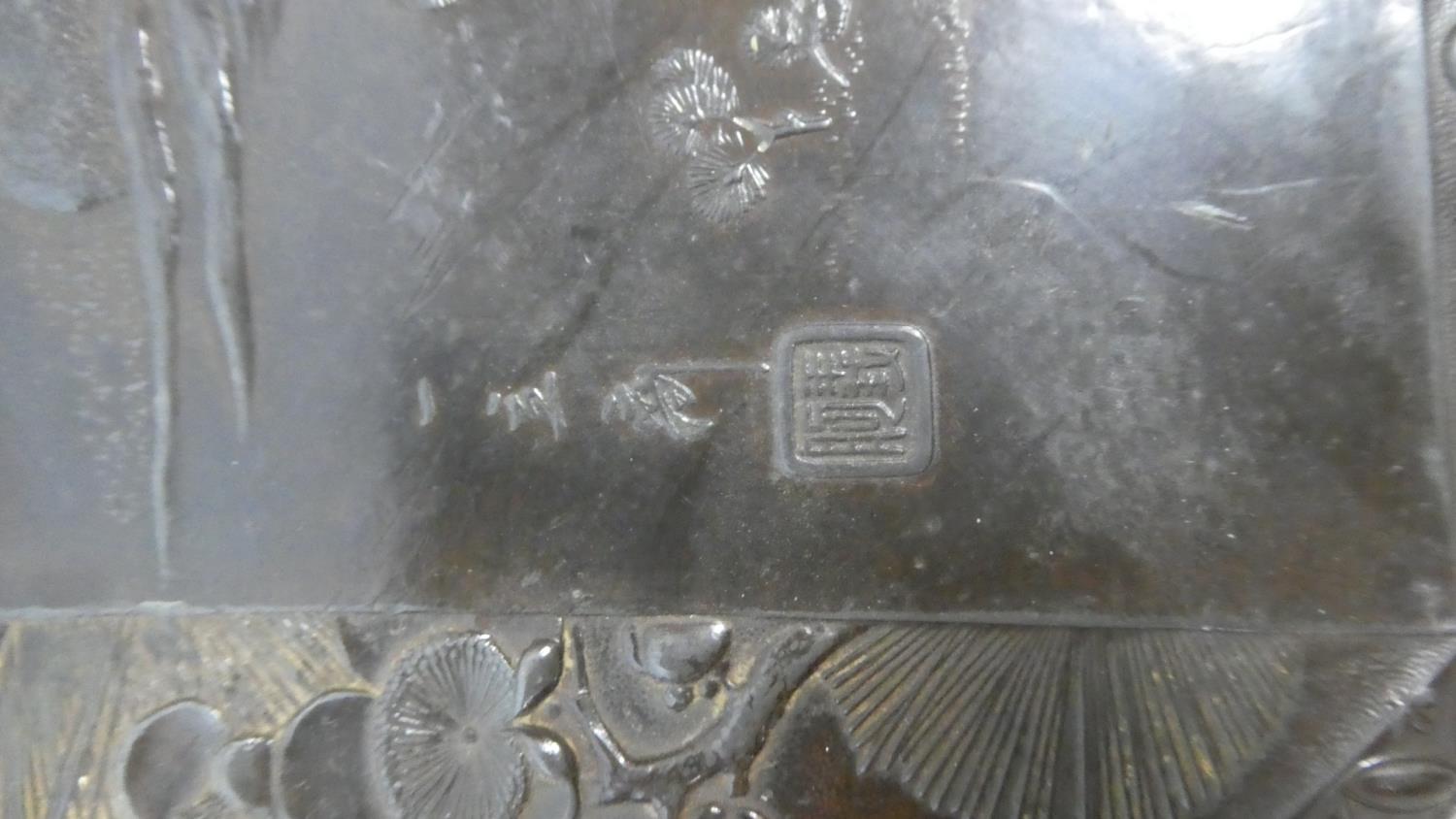 A 19th Century Japanese Circular Bronze Plaque Decorated in Relief with Figures, Willow Trees and - Image 2 of 2