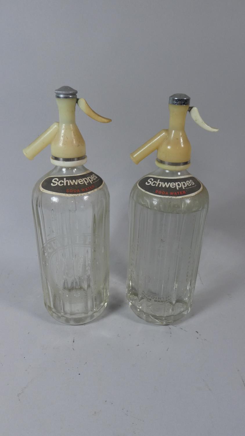 A Pair of Vintage Schweppes Soda Siphons with Engraved Ribbed Bodies, 37cm High