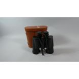 A Pair of Leather Cased 10x50 Binoculars