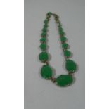 A Green Jade Effect Glass Bracelet