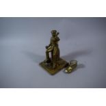 A Brass Figural Study of Seated Sailor Together with Brass Lucky Match Boot