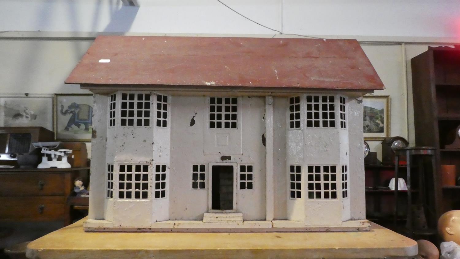 A Vintage Dolls House with Some Furniture, 71cm Long