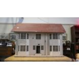 A Vintage Dolls House with Some Furniture, 71cm Long