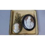 An Early White Metal Mounted Shell Cameo Depicting Child Carrying Kitten with Cat by Her Side in