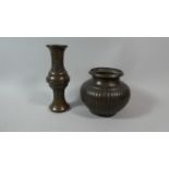 Two Oriental Bronze Vases One of Baluster Form with Ribbed Body the Other with Moulded Decoration in