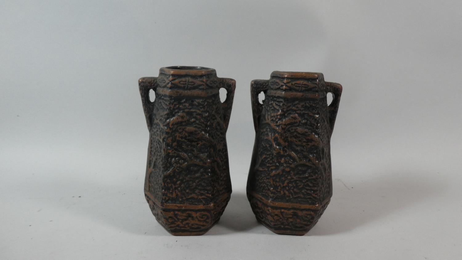 A Pair of Bretby Style Two Handled Hexagonal Vases Decorated in Relief with Birds on a Branch,
