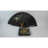 An Ebonised Fan with Hand Painted Floral Decoration Together with a Lacquered Box with Chrysanthemum