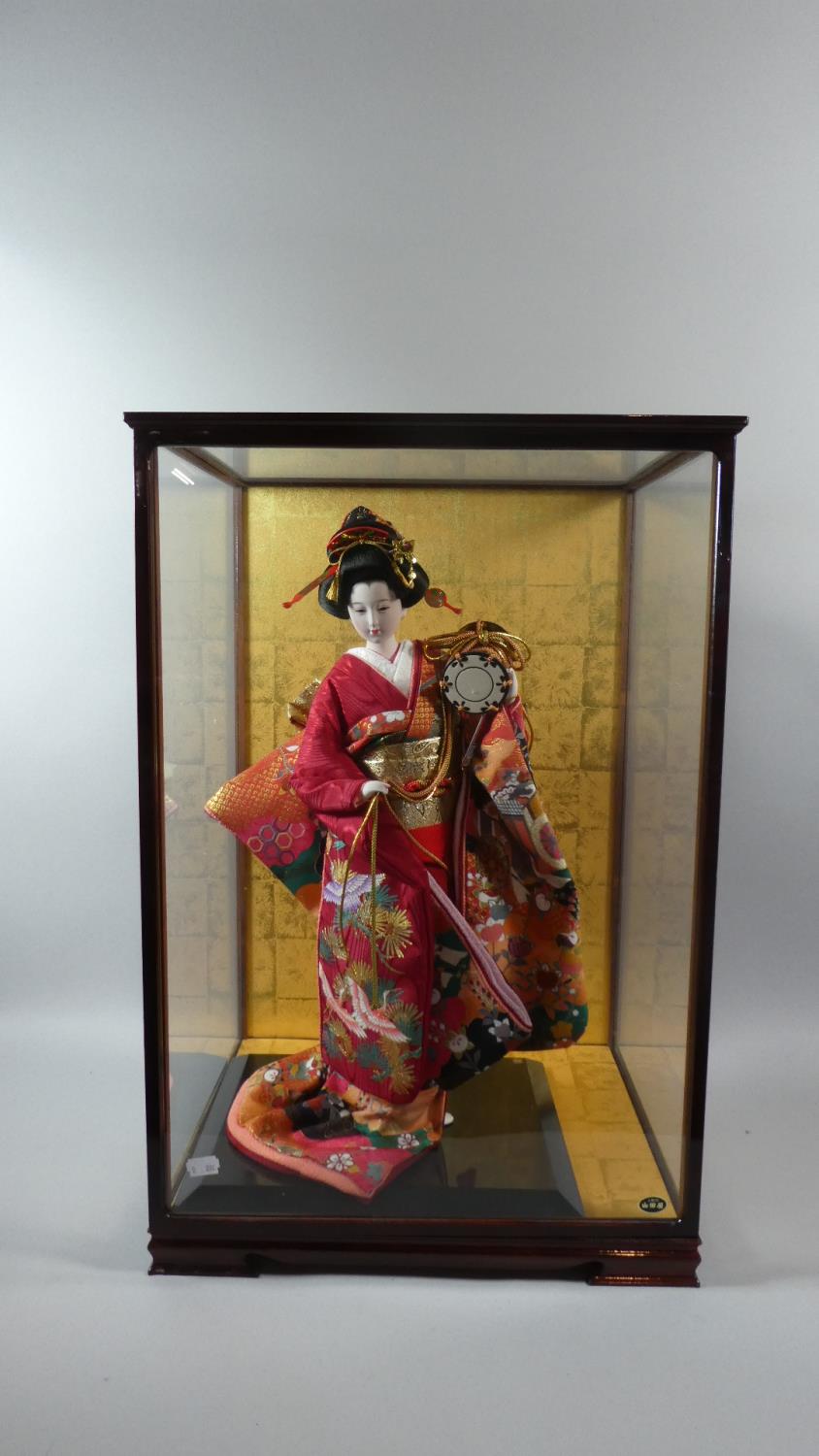 A Late 20th Century Cased Oriental Geisha Girl Doll, 64cm High