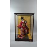 A Late 20th Century Cased Oriental Geisha Girl Doll, 64cm High