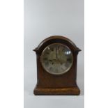 An Edwardian Oak Mantle Clock, the Dial Inscribed Pleasance and Harper, Shrewsbury, with Pendulum