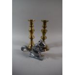 A Pair of Brass Candle Sticks and a Squirrel Nut Cracker