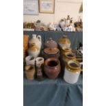 A Collection of Various Stoneware Jars and Bottles