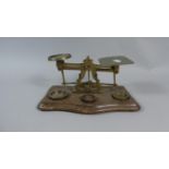 A Pair of Late Victorian/Edwardian Brass Postage Scales with Weights on Wooden Plinth, 23cm Wide