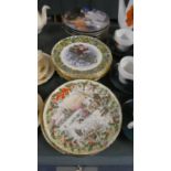 A Collection of Various Christmas and Angels Amongst Us Decorated Plates