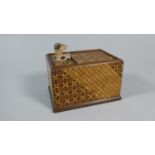 An Edwardian Novelty Wooden Cigarette Dispenser with Dog Push Button and Inlaid Chequer Board