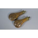 Two Copper and Brass Shot Flasks One Decorated with Pheasants in Relief and the Other with Scroll