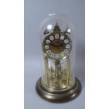 A Brass Pillar Clock by Haller with Key and Instructions