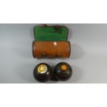 A Pair of Leather Cased Lawn Bowls, The Waterloo