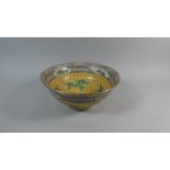 A Large Chinese Bowl Decorated with Coloured Enamels Depicting Dragons and Scrolls Bordered by a