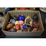 A Box Containing Glass Paperweights, Stone Eggs etc