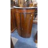 A 19th Century Bow Fronted Oak and Mahogany Corner Cabinet, 62cm Wide