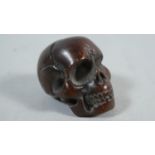 A Carved Netsuke in the Form of a Skulls, 2.5cm High