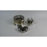 A Silver Plated Wine Coaster, Silver Plated Cruet and Three Napkin Rings