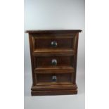 A Stained Pine Three Drawer Chest with Turned Wooden Handles, 59cm high