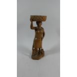 A Carved Wooden Figural Stand in the Form of Standing Mother with Child and Dog at Feet, 30cm High