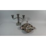 A Collection of Silver Plate to Include Three Branch Candelabra, Three Shell Shaped Salts and a