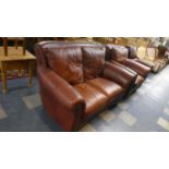 A Leather Two Seater Settee and Matching Armchair