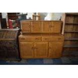 An Ercol Sideboard with Two Long Drawers Over Three Cupboard Base, Raised Cupboard Top, 136cm Long