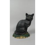 A Modern Cast Iron Door Stop in the Form of a Seated Black Cat, 29cm High
