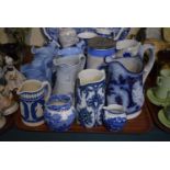 A Tray Containing Eleven 19th Century and Later Blue and White Jugs Including Jasperware, Willow