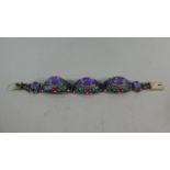 A Chinese White Metal Sectional Bracelet Having Filigree Enamel Work Mounts and Cabochon Purple