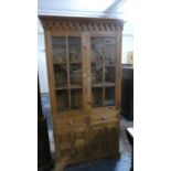 A Pine Glazed Cabinet with Two Centre Drawers Over Cupboards, 106cm Wide