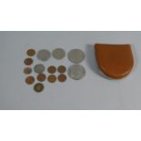 A Small Collection of Foreign and American Coins to Include Two American Dollars, Half Dollar,