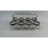 A Set of Eight Glass Tumblers Set in Chromed Carrying Frame, 38cm Long