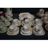 A Floral Patterned Collection of English Bone China Tea Wares Comparing Six Trios, Cake Plate