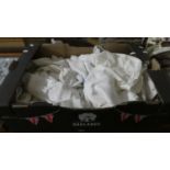 A Box Containing Various Table Linens