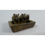 A Small Chinese Bronze Study Depicting Three Pigs at Trough, 5cm Wide