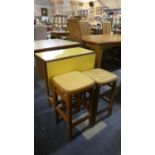 A 1950's Formica Topped Kitchen and Two Stools