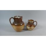 Two Doulton Lambeth Salt Glazed Stoneware Jugs, The Smaller Example with Silver Rim 14.5cm High, the