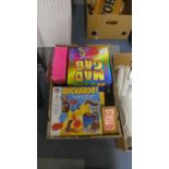 A Box Containing Various Borad Games, Chess Pieces Etc