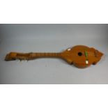 A Wooden Four String Musical Dulcimer