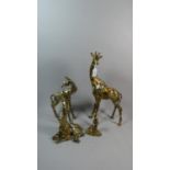 A Collection of Four Giraffe Ornaments, The Tallest 44cm high