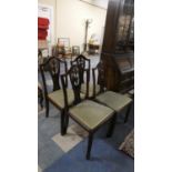 A Set of Four Mahogany Framed Dining Chairs with Pierced Vase Splats